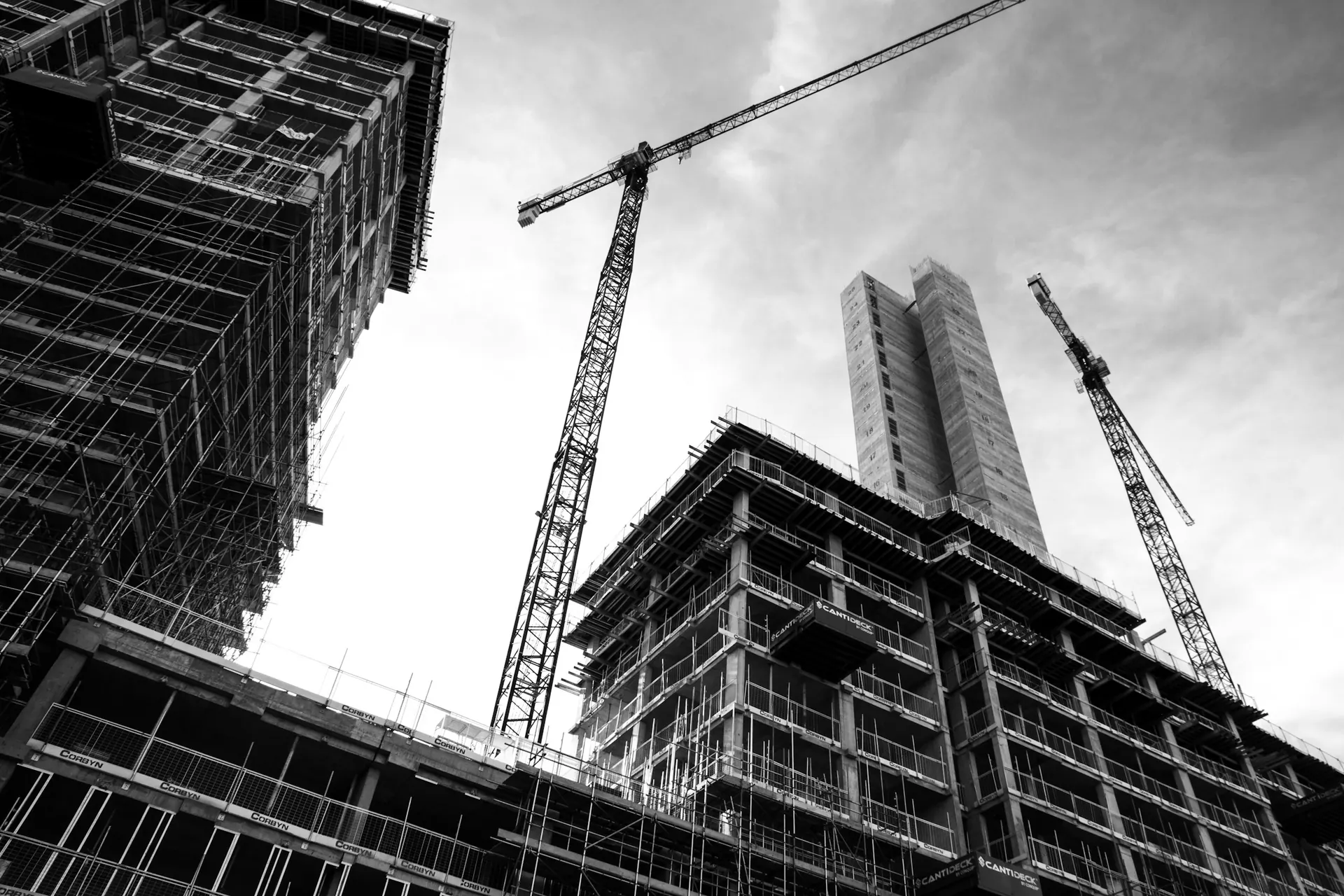High-rise buildings under construction with tower cranes