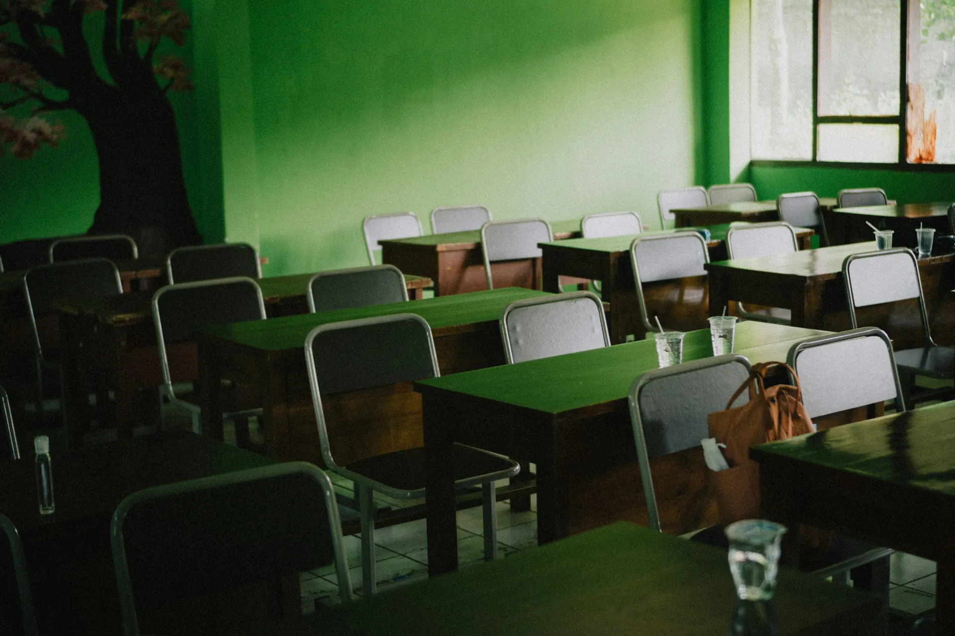 Empty school classroom with desks and chairs