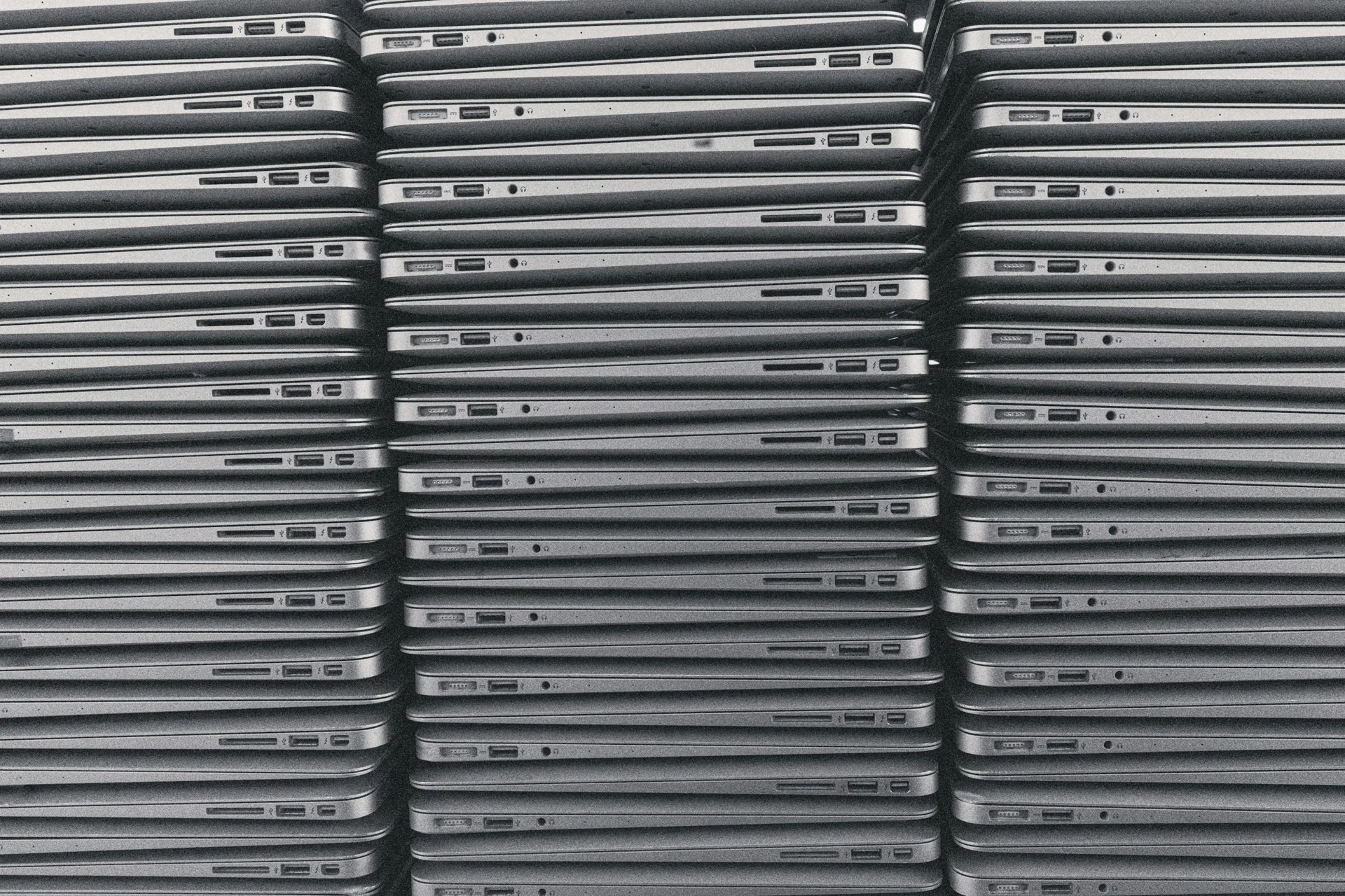 Rows of identical laptops ready for a leasing customer